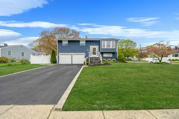 a house view with a garden space