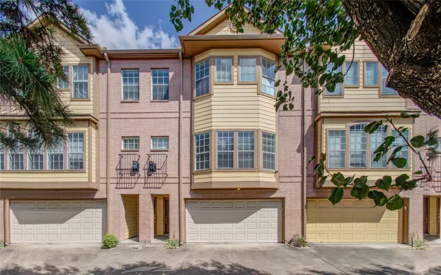 a front view of a house with a street