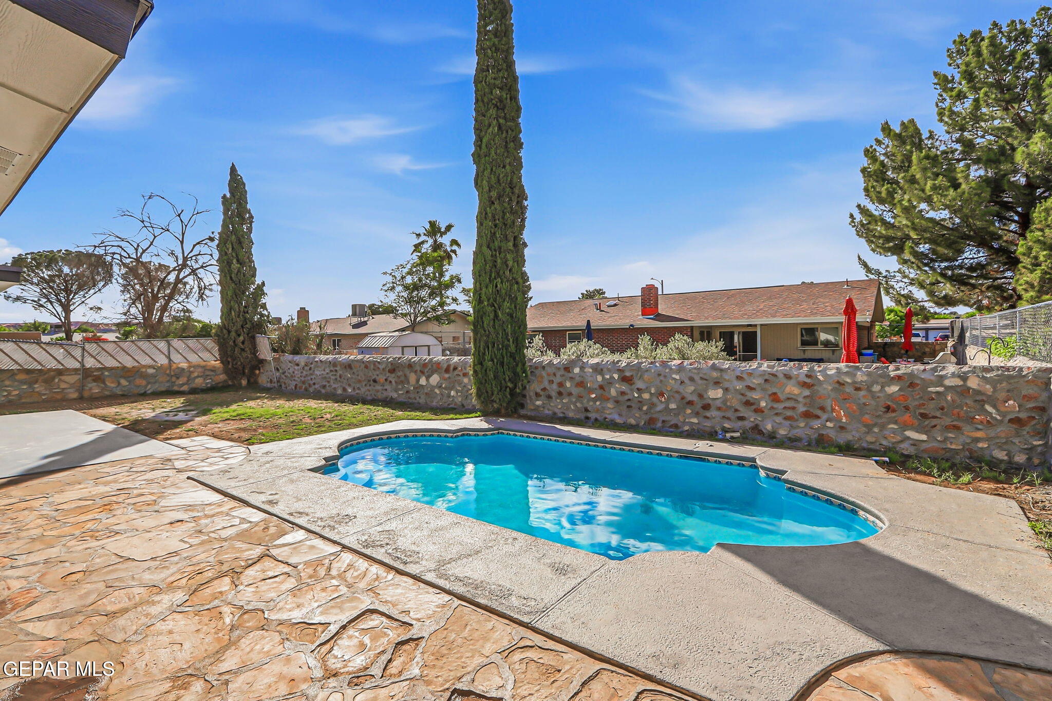 709 Frontera Road El Paso, TX 79922 - Photo 41 of 41 a view of a swimming pool with a lounge chairs