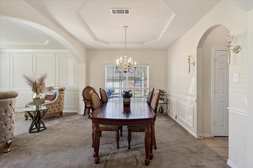 7308 Hawk Lane Sachse, TX 75048 - Photo 7 of 37 a view of a dining room with furniture window and outside view