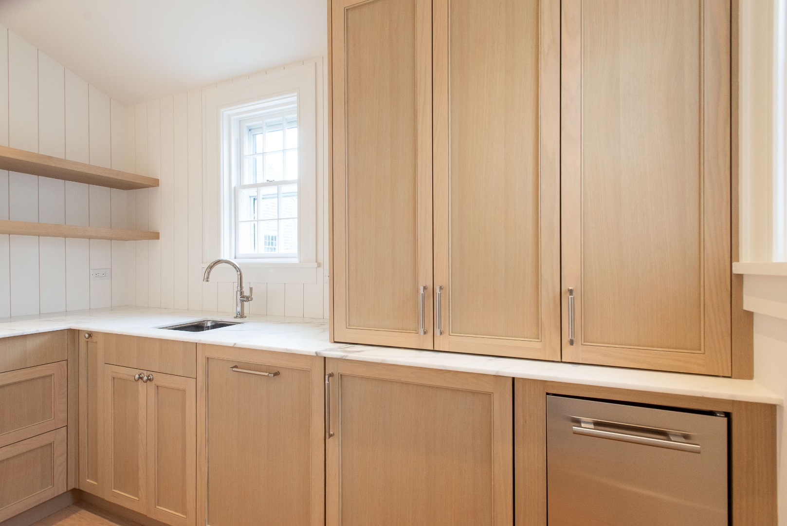 10 Silver Street Nantucket, MA 02554 - Photo 18 of 48 a view of a kitchen with white cabinets