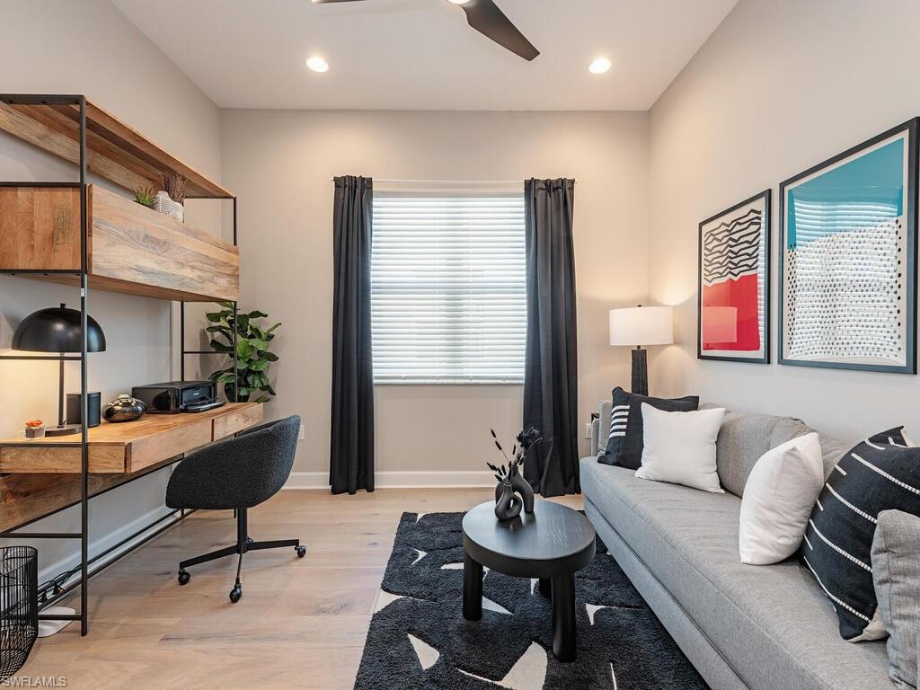 12456 Violet Lane Naples, FL 34120 - Photo 21 of 34 a living room with furniture and a potted plant