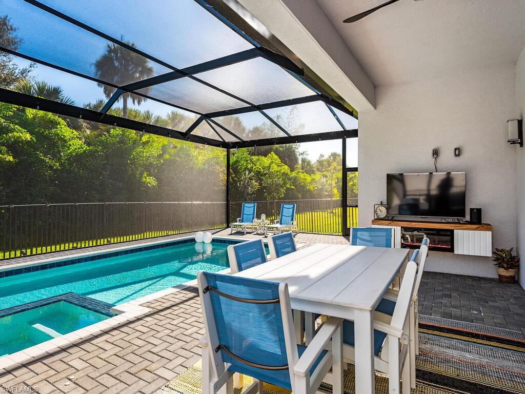 12456 Violet Lane Naples, FL 34120 - Photo 22 of 34 a view of outdoor space with seating area