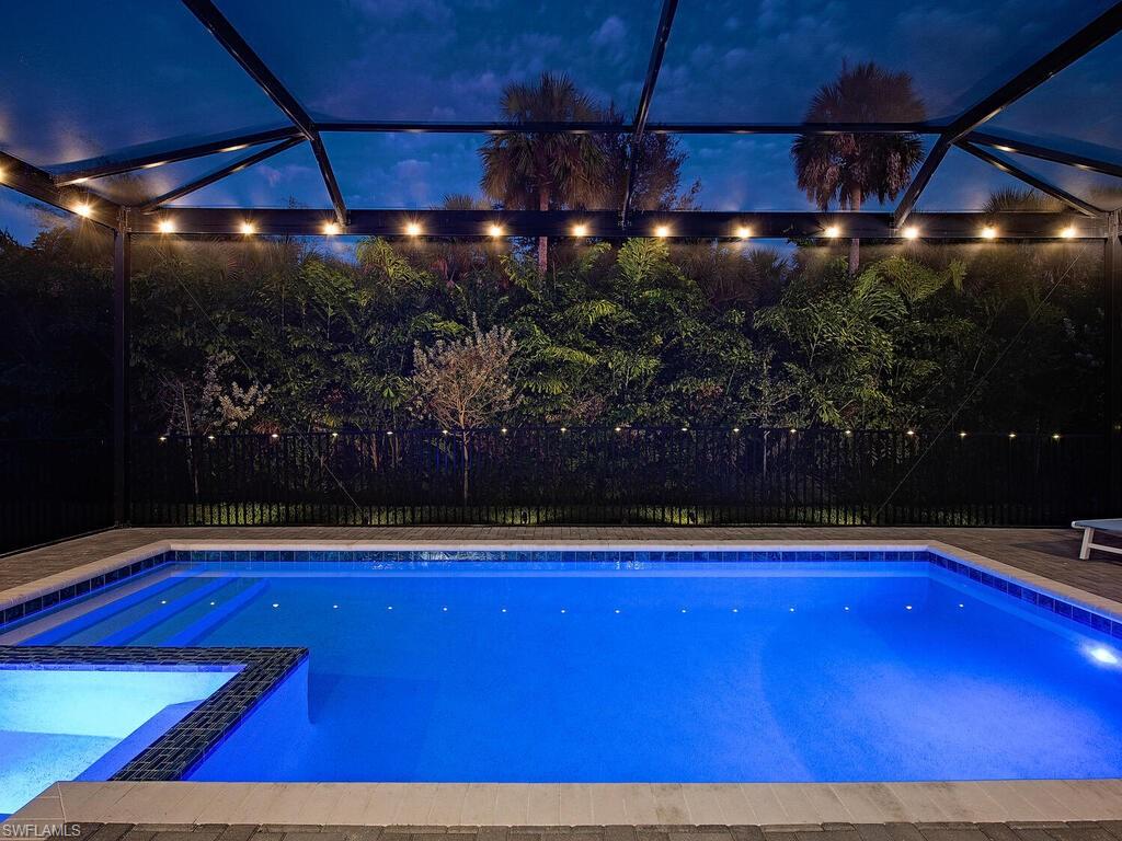 12456 Violet Lane Naples, FL 34120 - Photo 4 of 34 a room with lots of green space and shower