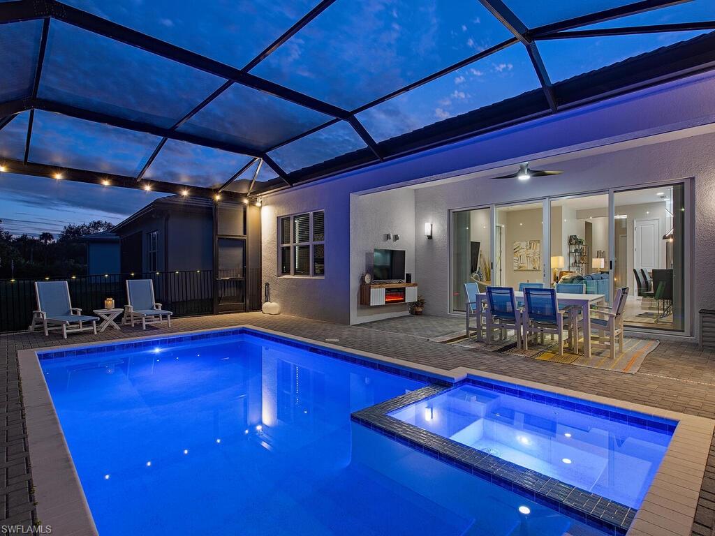 12456 Violet Lane Naples, FL 34120 - Photo 6 of 34 a view of swimming pool with dining room