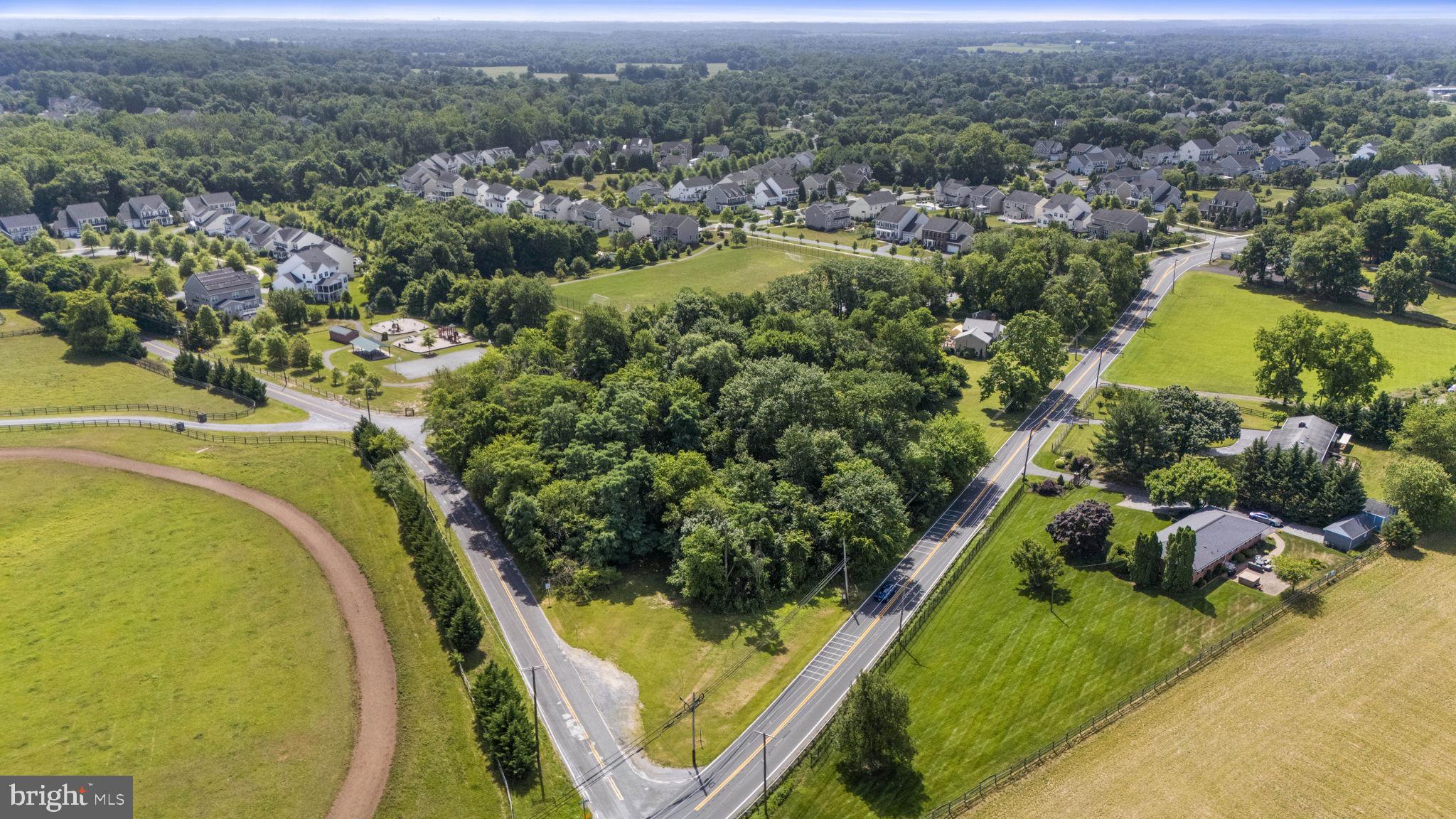 Beallsville Road Poolesville, MD 20837 - Photo 8 of 21 an aerial view of residential houses with outdoor space and swimming pool