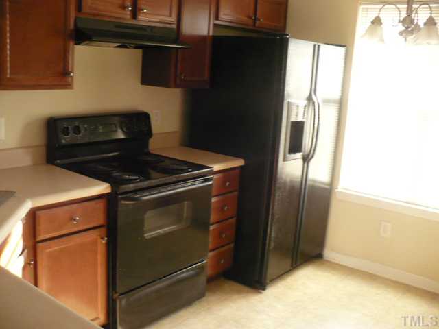 3812 Bison Hill Lane Raleigh, NC 27604 - Photo 3 of 14 a kitchen stove sitting inside of a kitchen