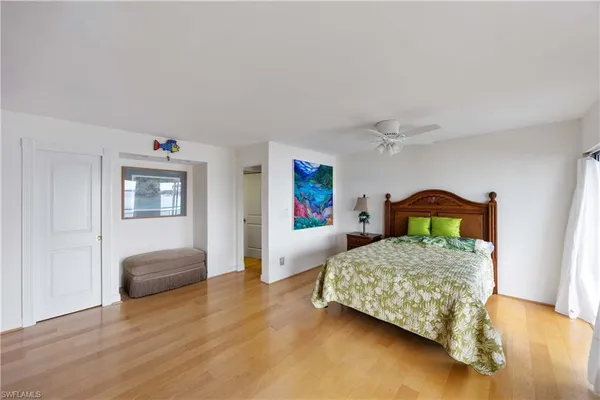 a bedroom with a bed and a couch