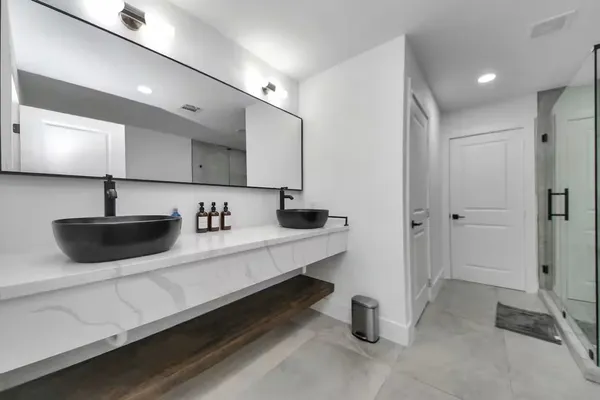 a kitchen with stainless steel appliances a sink a stove and a refrigerator