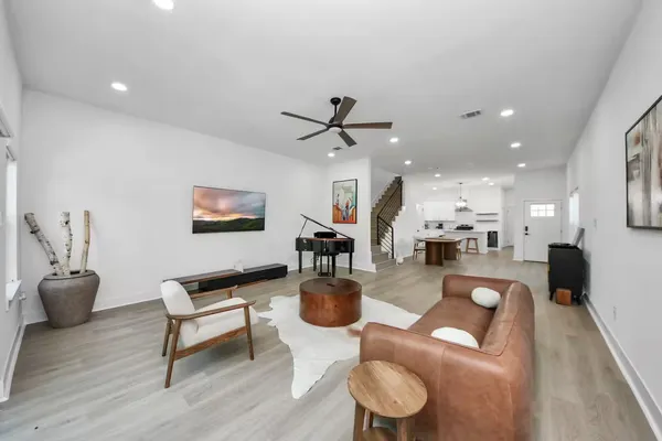 a living room with furniture and a table