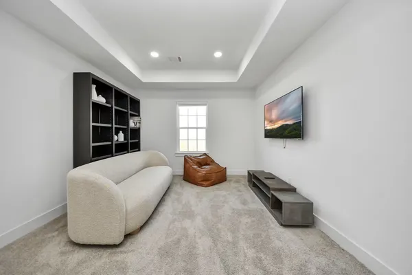 a room with furniture and a flat screen tv