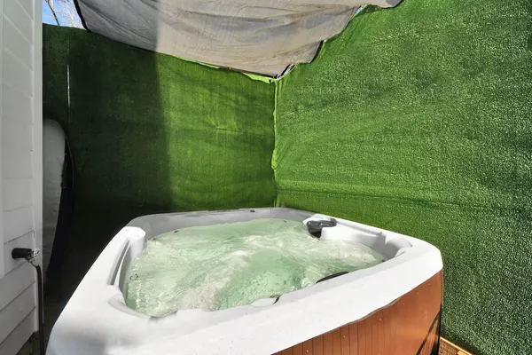 a view of a swimming pool in a backyard