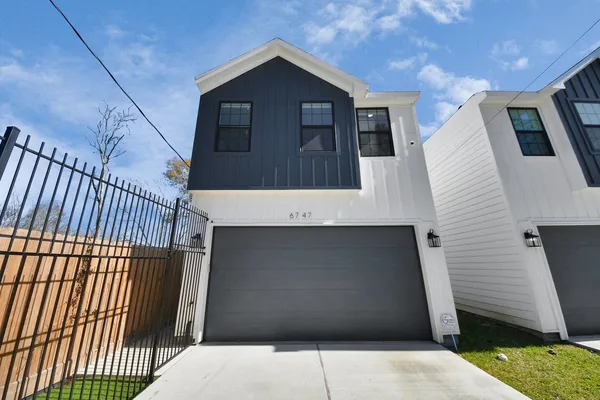 a view of a house with a garage