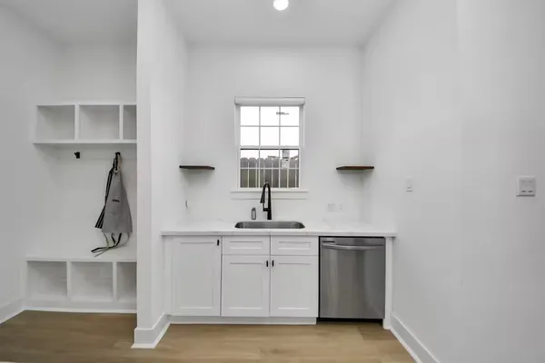 a kitchen with a sink and cabinets