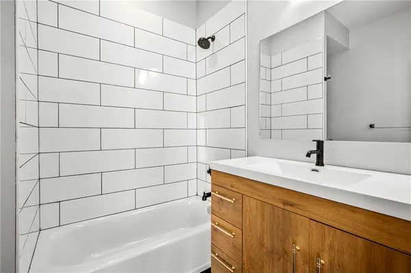 a bathroom with a sink and a bathtub