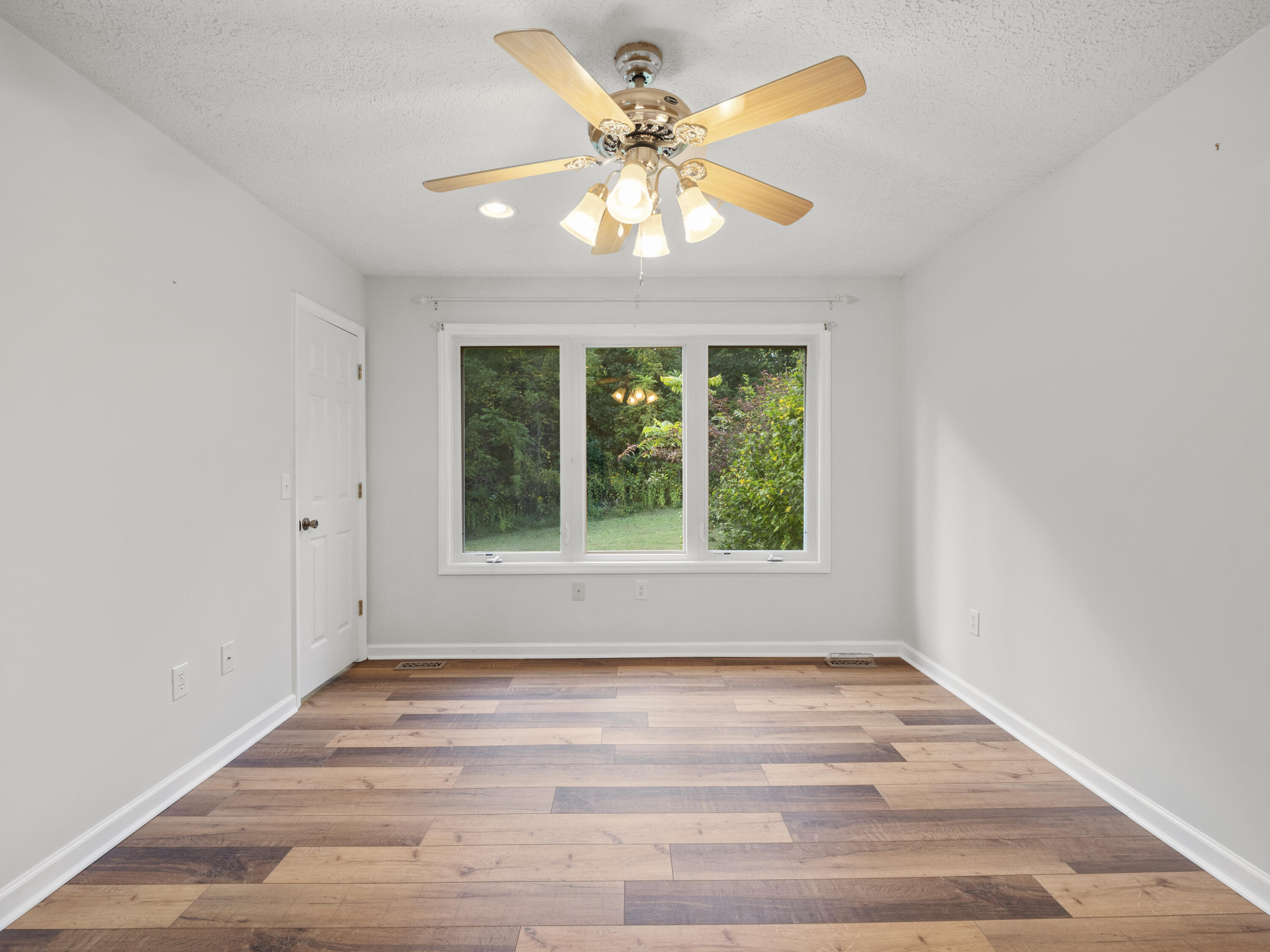 885 Whetstone Road Ferrum, VA 24088 - Photo 22 of 64 a view of an empty room with wooden floor and a window