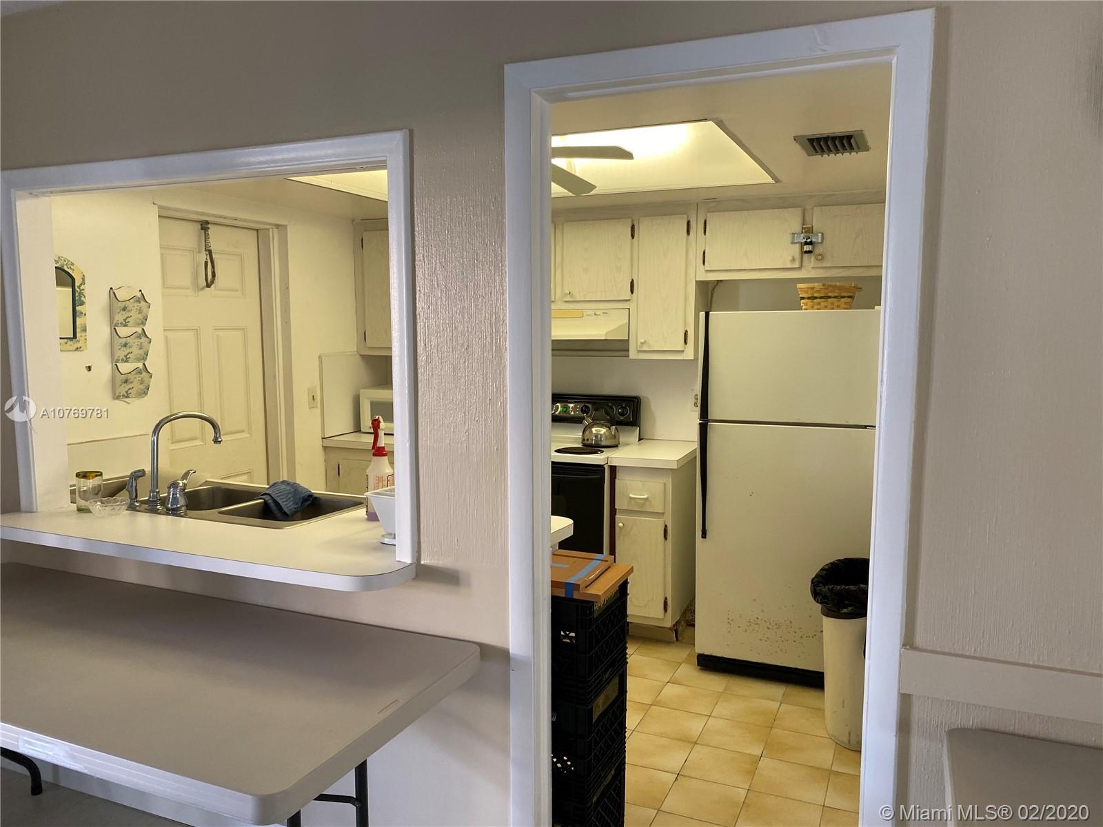 9855 Sandalfoot Boulevard, Unit 318 Boca Raton, FL 33428 - Photo 36 of 36 Clubhouse kitchen