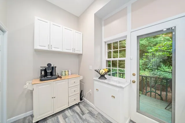 a view of a kitchen with sink cabinets and wooden floor