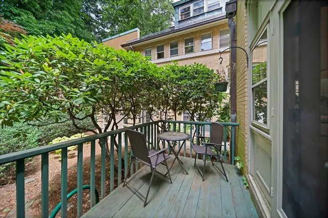 a balcony view with a seating space