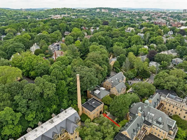 an aerial view of a house with a yard