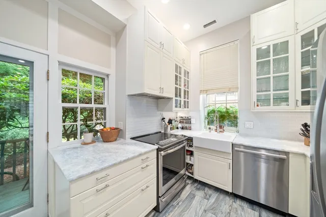 a kitchen that has a sink and a stove
