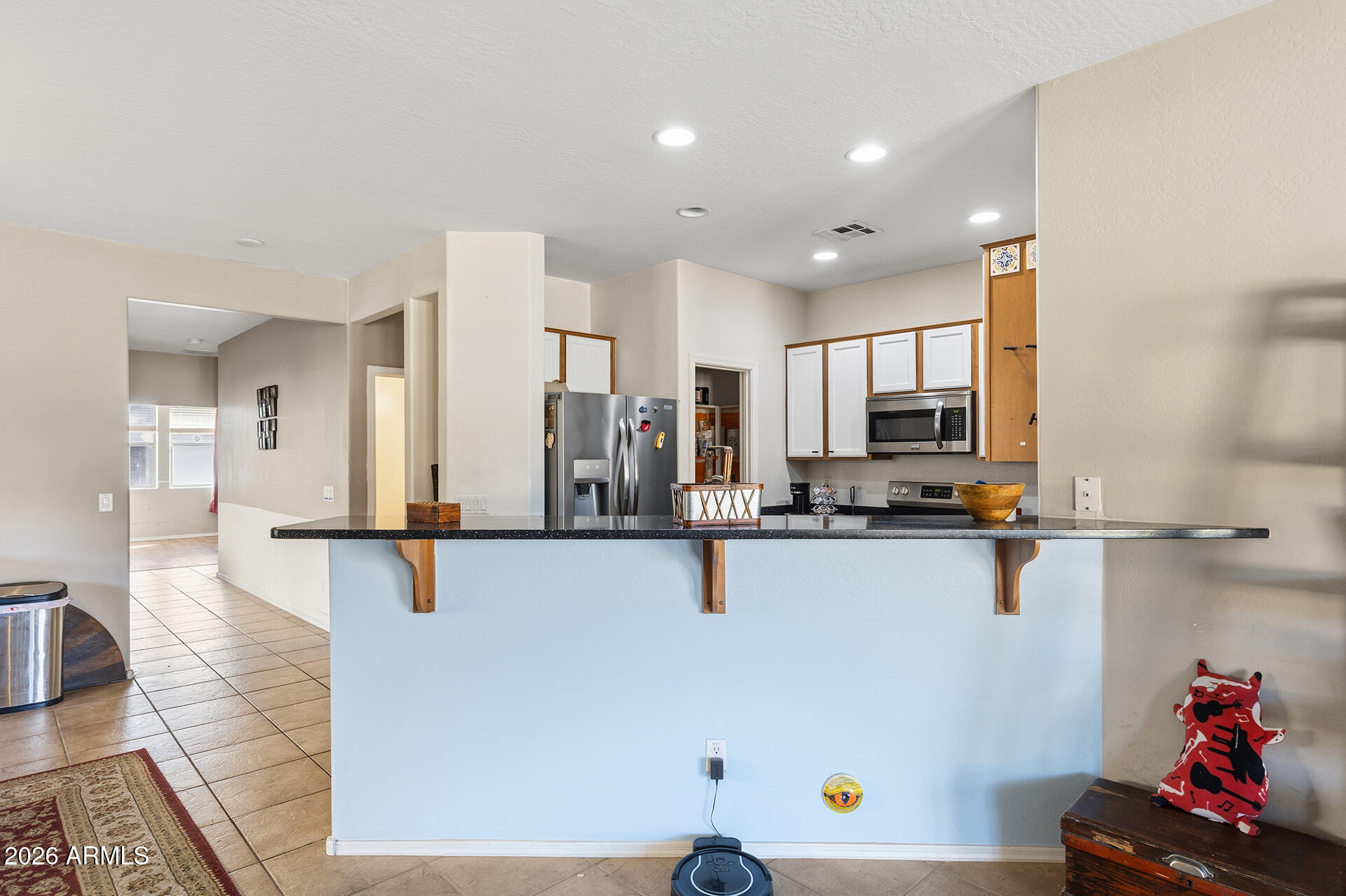 6718 West Darrel Road Laveen, AZ 85339 - Photo 41 of 49 a view of kitchen with furniture and wooden floor