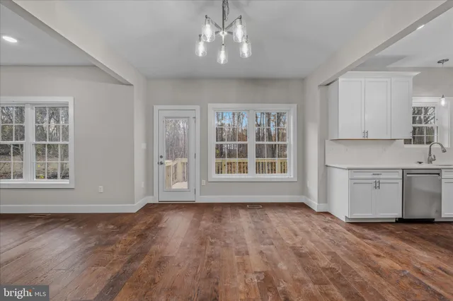 a aerial view of a house with a yard