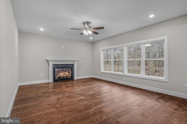 a view of backyard with deck and trees
