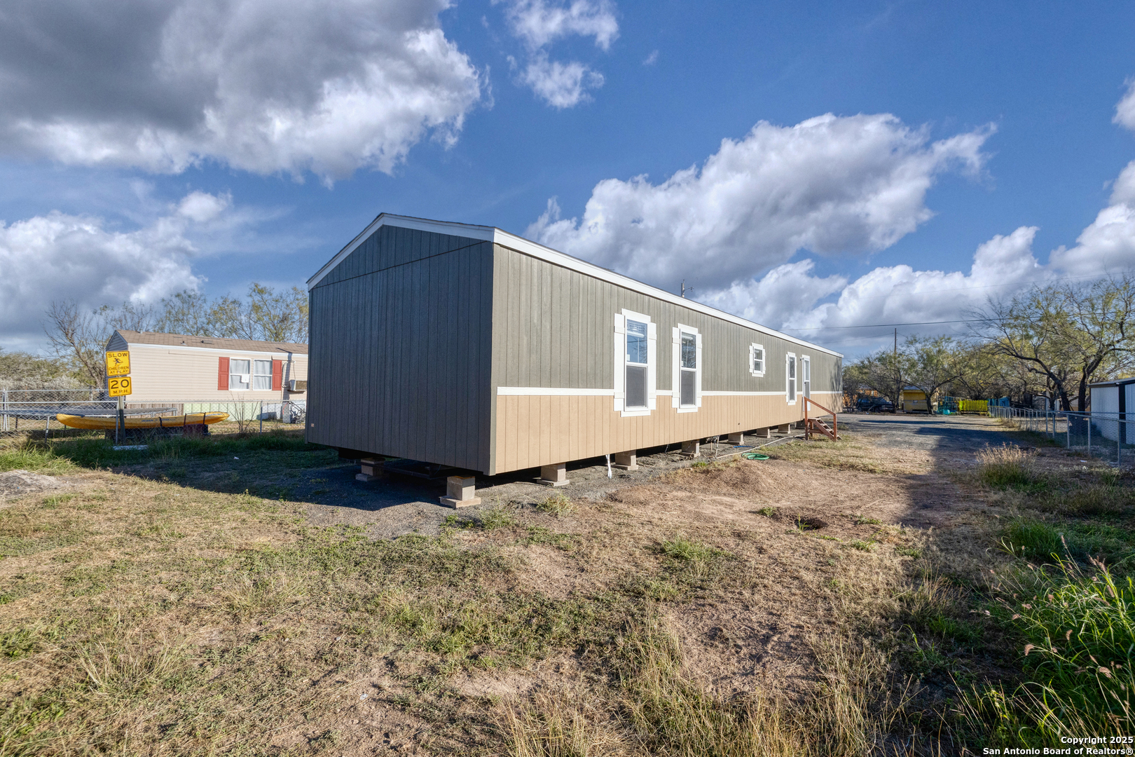 138 Senisa Drive Uvalde, TX 78801 - Photo 4 of 25 a view of a house with backyard and a tree