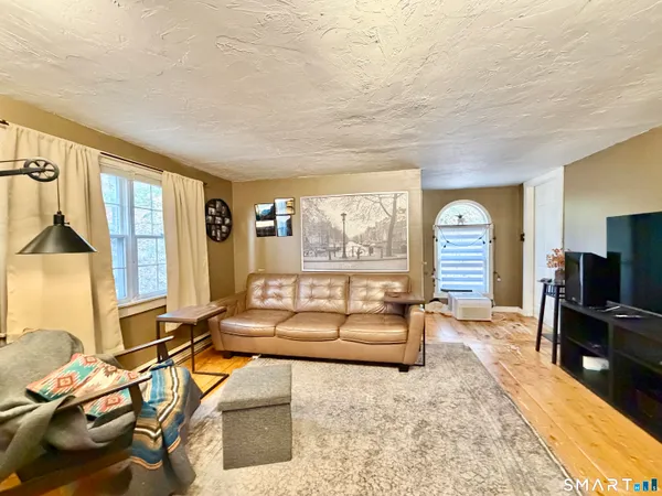 a living room with furniture and a table