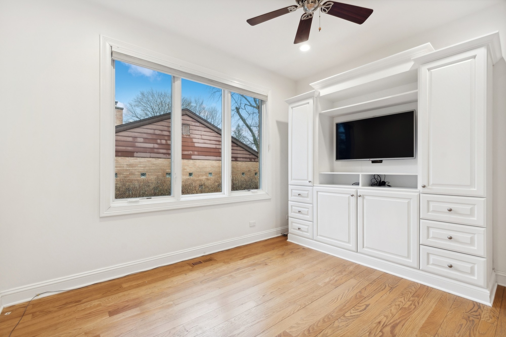1603 Hertel Lane Deerfield, IL 60015 - Photo 14 of 27 a view of workspace with flat screen tv