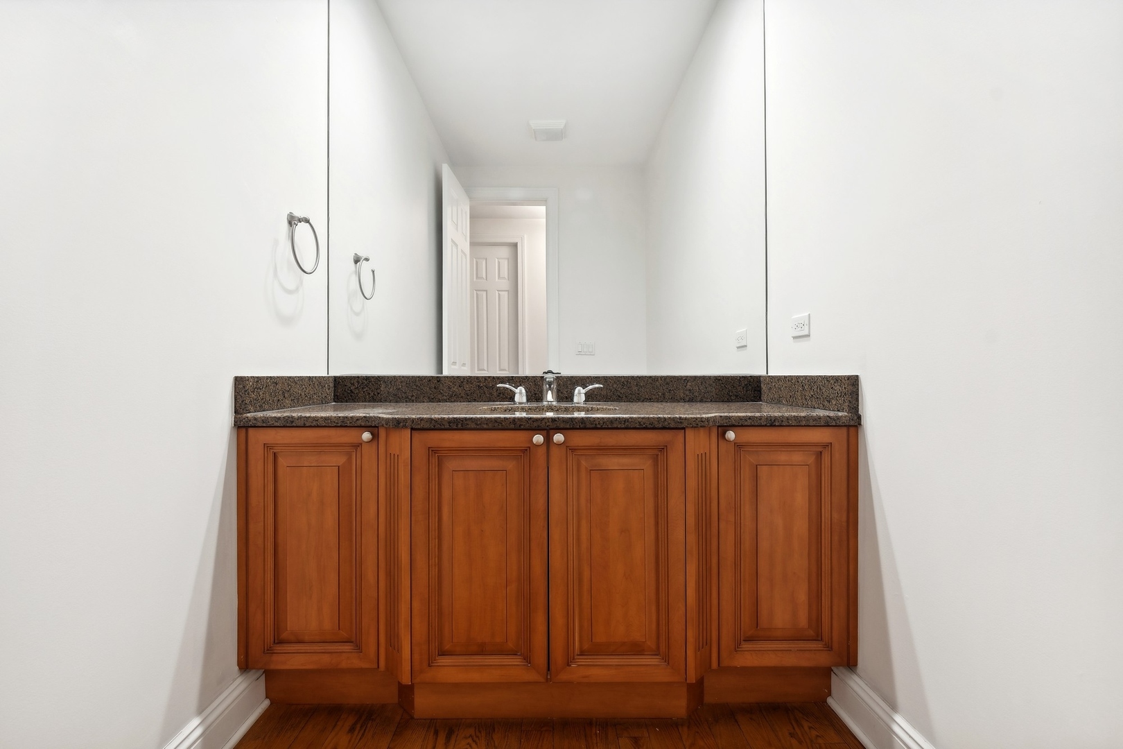 1603 Hertel Lane Deerfield, IL 60015 - Photo 15 of 27 a bathroom with a sink and a mirror