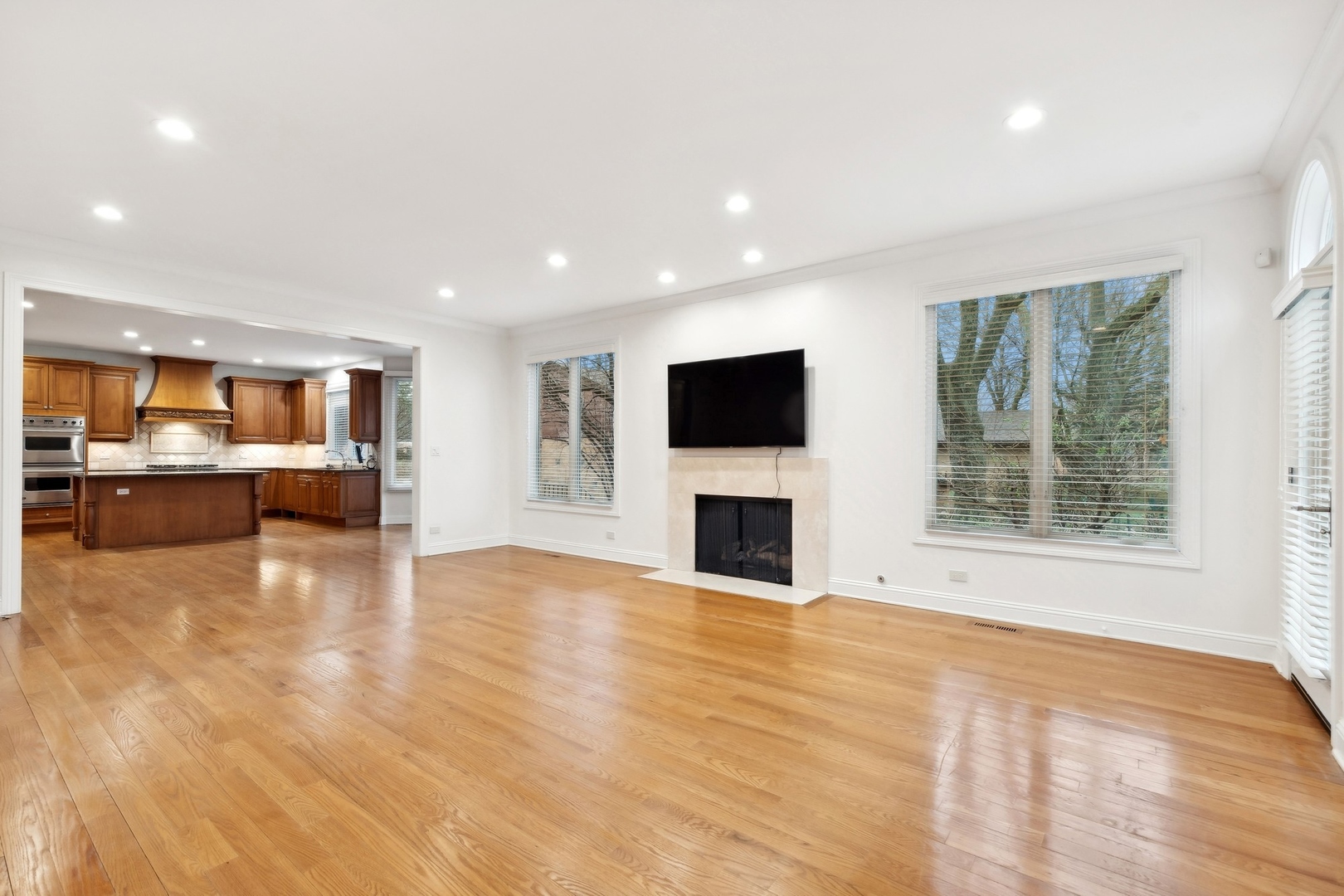 1603 Hertel Lane Deerfield, IL 60015 - Photo 8 of 27 a view of empty room with wooden floor and a fireplace