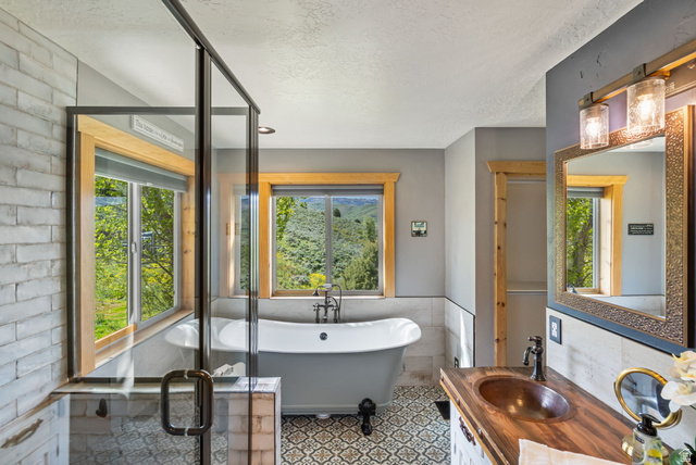 2013 North River View Road Huntsville, UT 84317 - Photo 19 of 53 Full bath featuring vanity, a soaking tub, healthy amount of natural light, tile walls, and a textured ceiling
