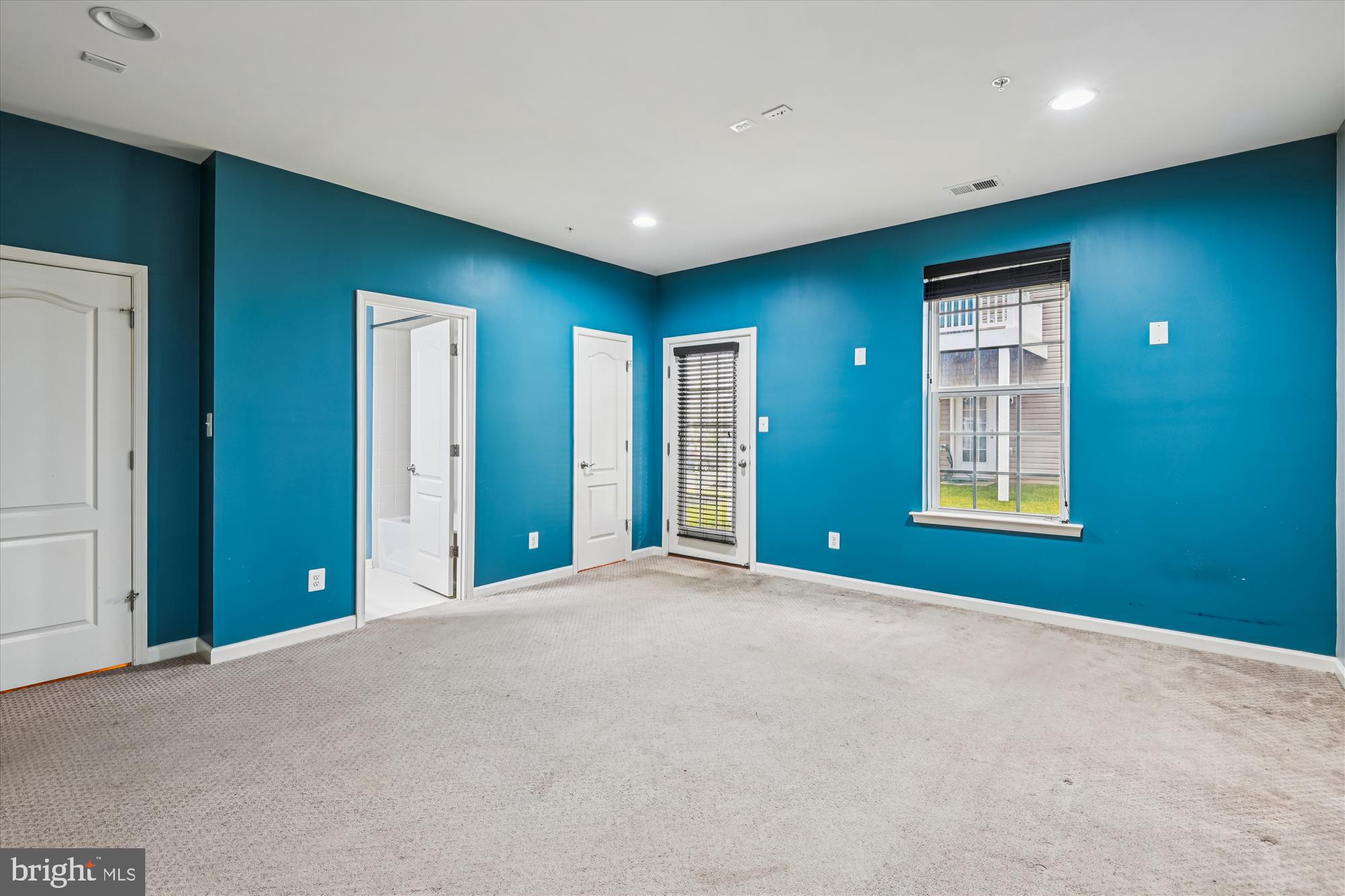 7749 Dagny Way Elkridge, MD 21075 - Photo 27 of 33 a view of an empty room with glass door
