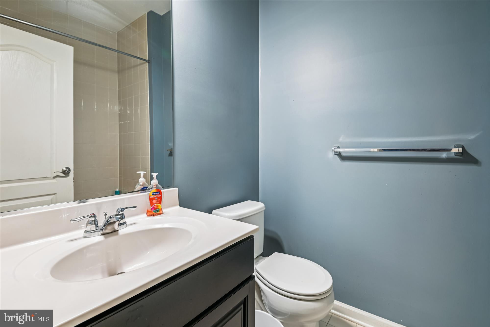 7749 Dagny Way Elkridge, MD 21075 - Photo 29 of 33 a bathroom with a sink toilet and a mirror