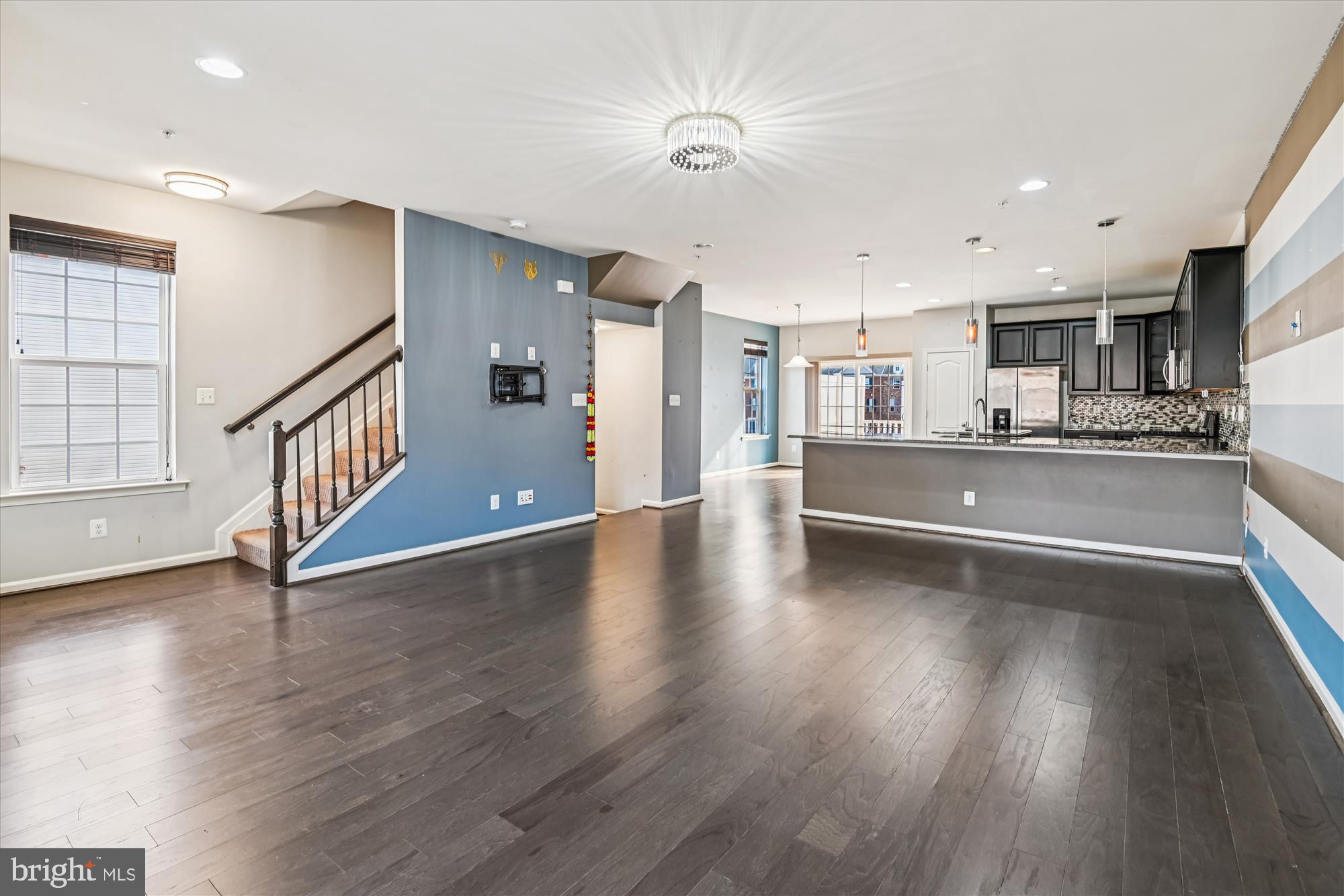 7749 Dagny Way Elkridge, MD 21075 - Photo 8 of 33 a view of a kitchen with wooden floor and electronic appliances