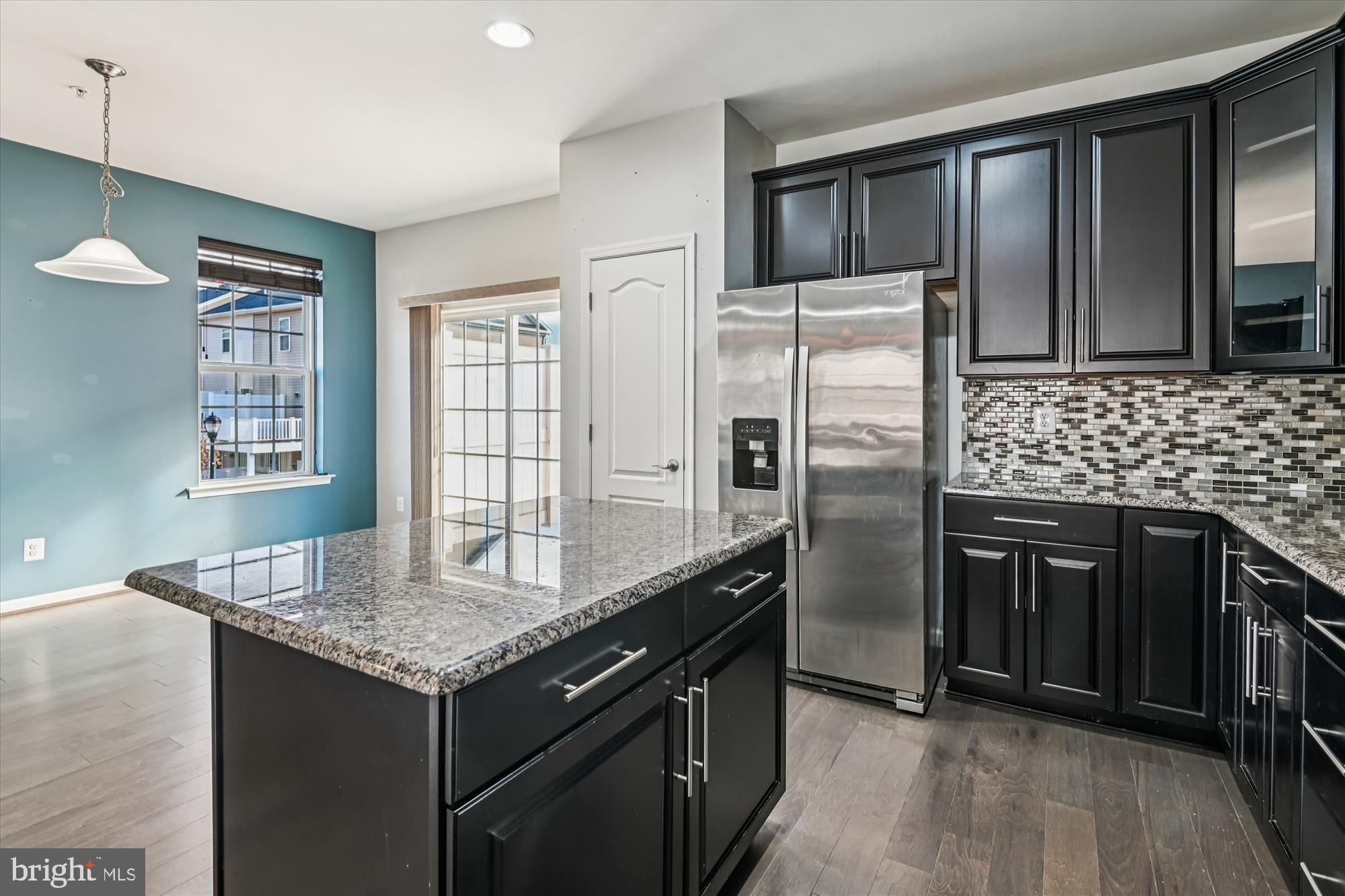 7749 Dagny Way Elkridge, MD 21075 - Photo 10 of 33 a kitchen with stainless steel appliances granite countertop a refrigerator a stove and a sink