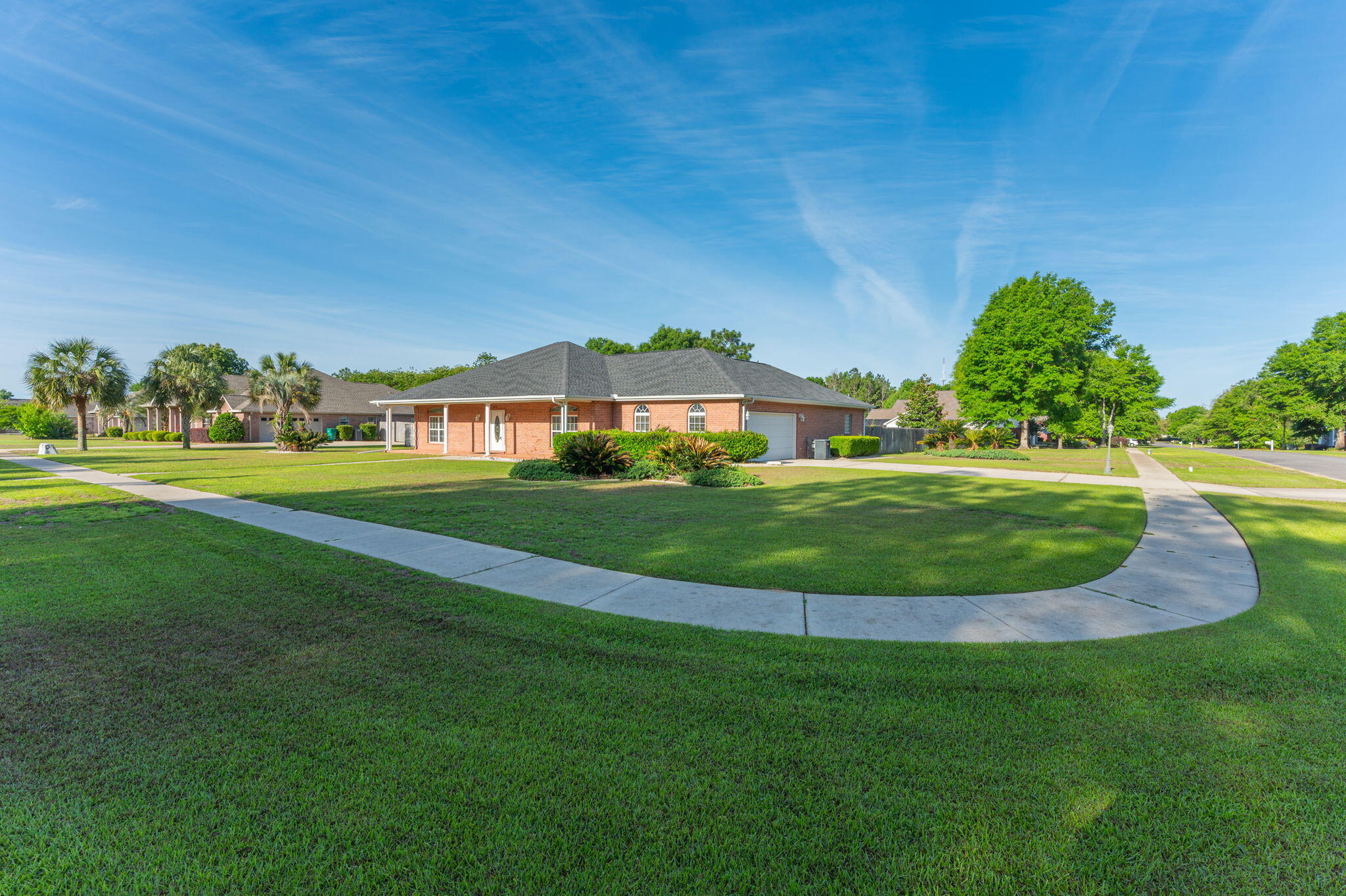 5552 Frontier Drive Crestview, FL 32536 - Photo 1 of 50 a view of a big yard with plants and large trees