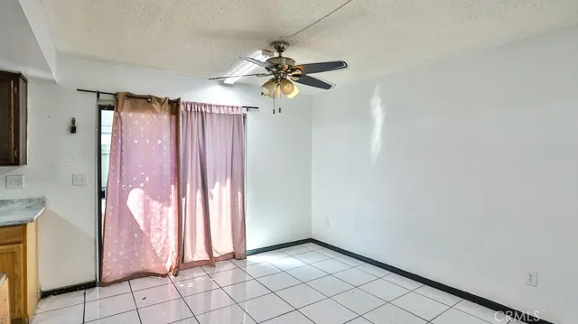a view of a chandelier fan and entryway