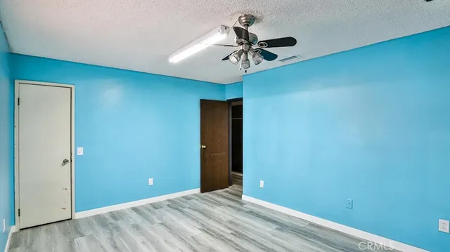 a view of room with window and ceiling fan