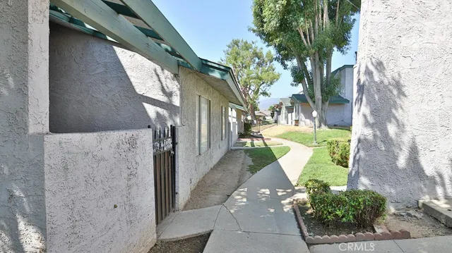 a view of a house with a small yard