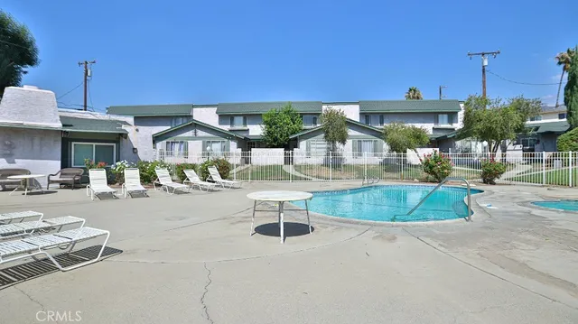 a view of a swimming pool with a patio