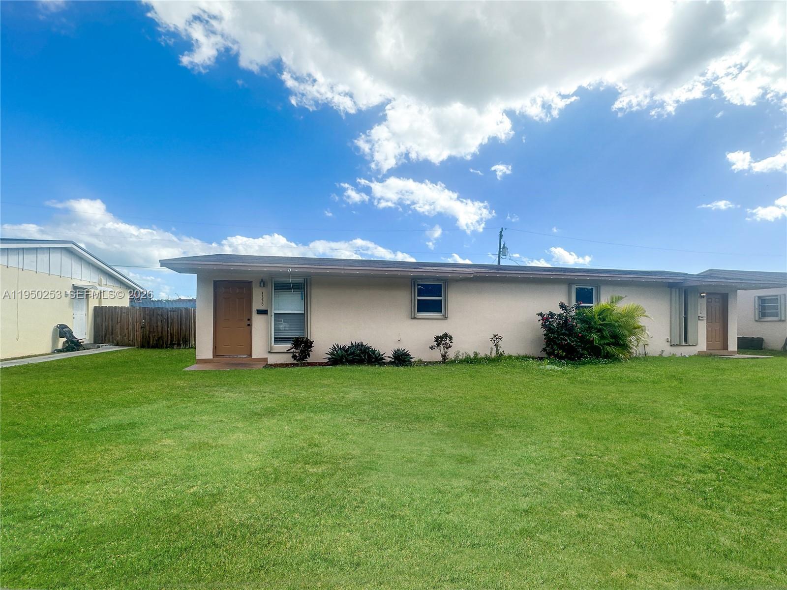 a view of a house with a back yard