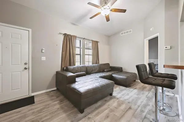 a living room with furniture and a window