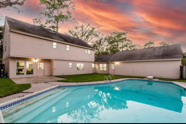 a view of an entryway with wooden floor and a large window