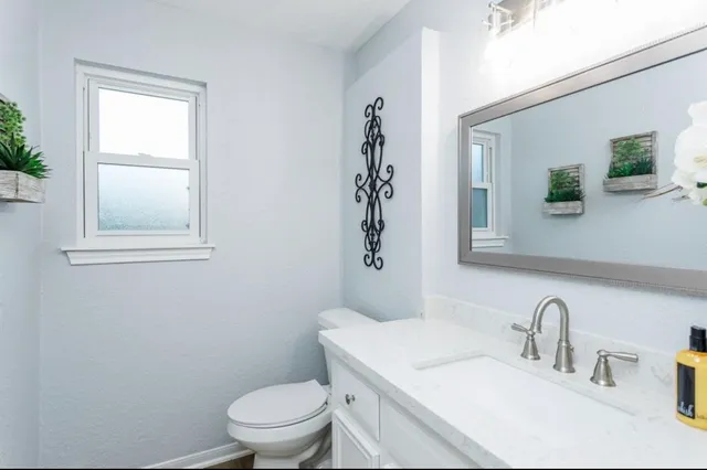 a bathroom with a sink and a toilet