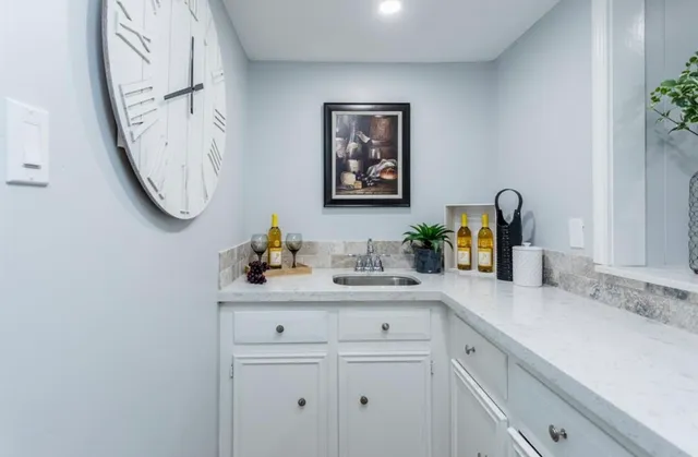 a view of a storage & utility room in closet with wooden floor