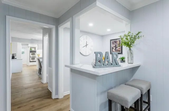 a view of a kitchen with a dishwasher cabinets and a wooden floor