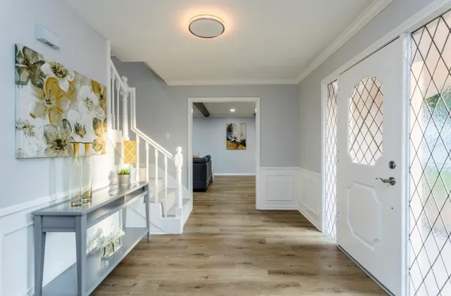 a kitchen with kitchen island granite countertop a sink a stove and cabinets
